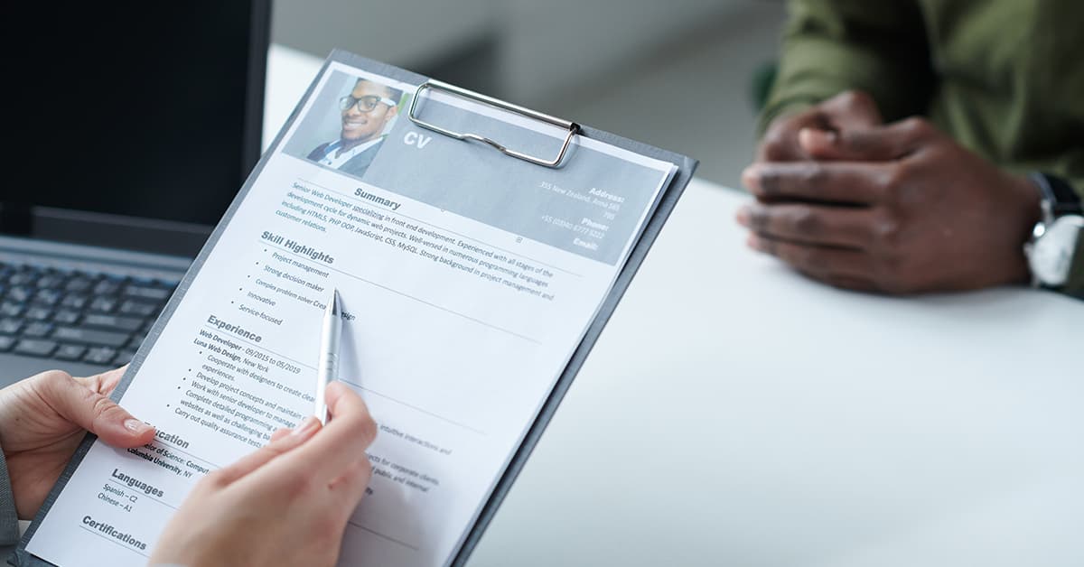 A person's CV being looked at during an interview process.