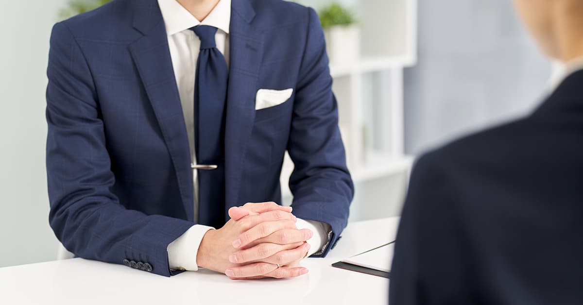 Man having an interview wearing a shirt.