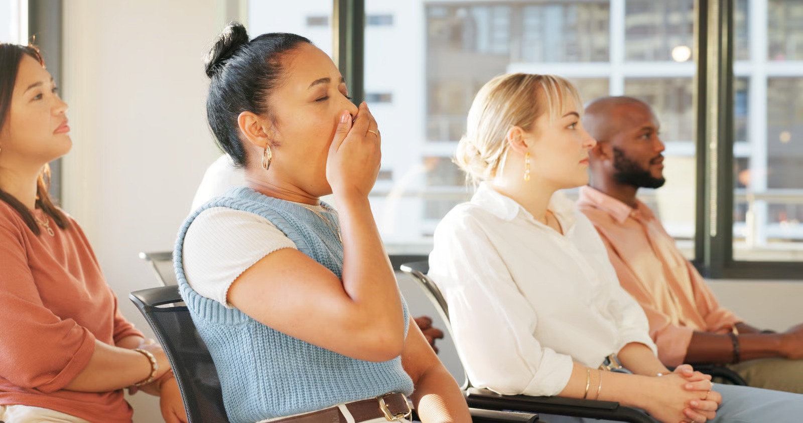 A woman yawning during a course.